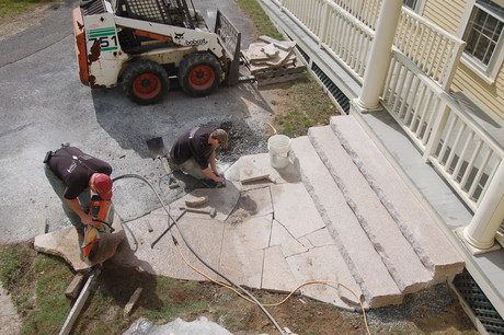Millenium Granite installers finish the new entryway