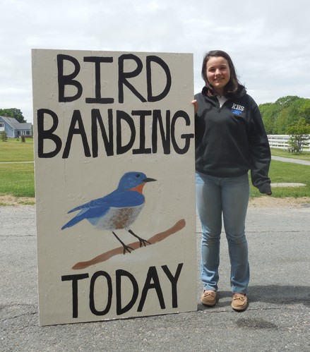 Andrea Dest and her bird banding sign