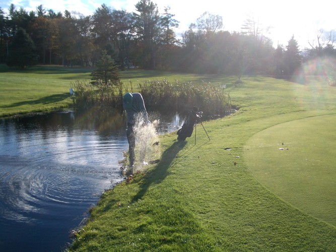 An anonymous competitor deals with a water hazard