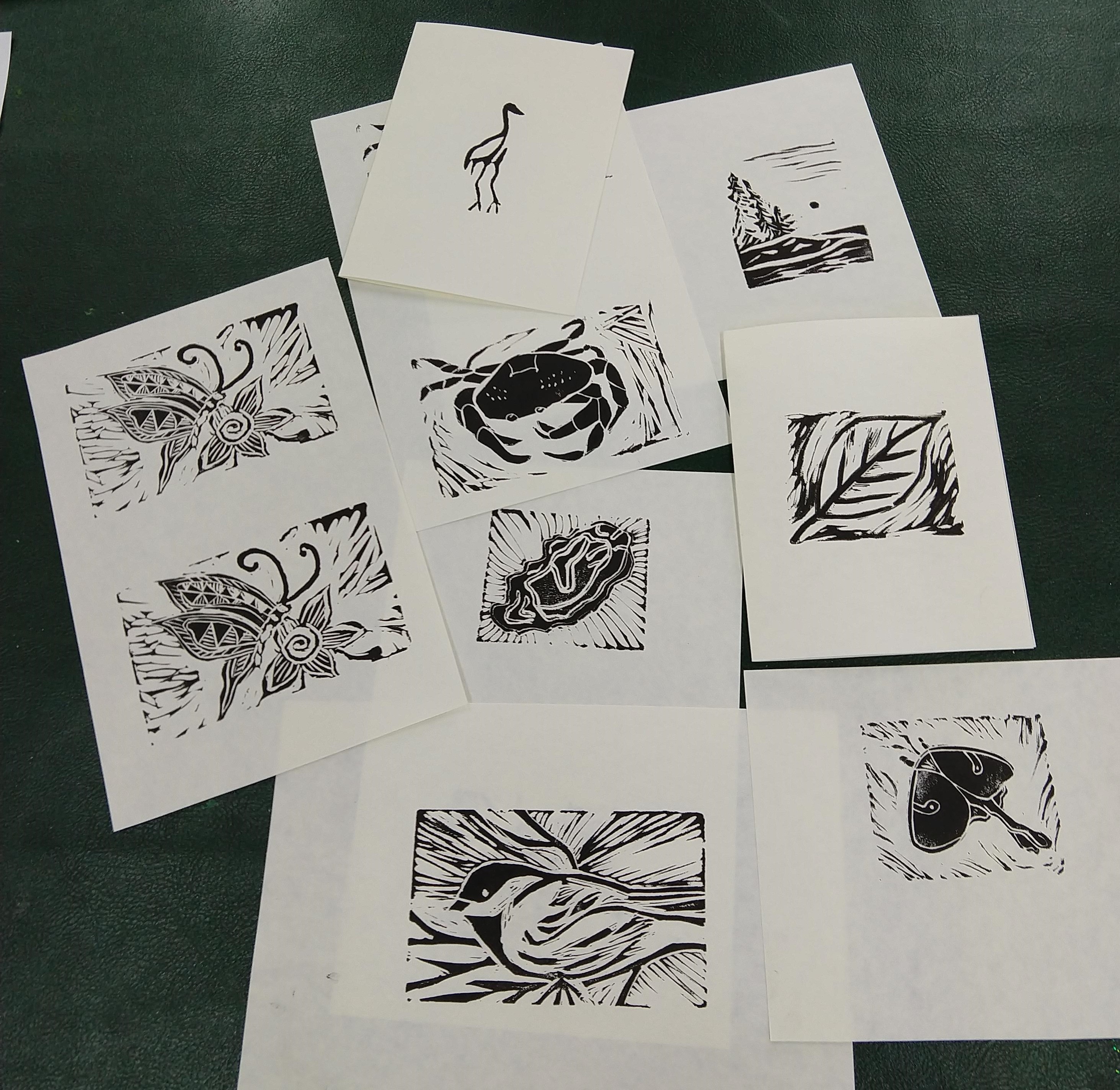 A set of block prints with various nature subjects.