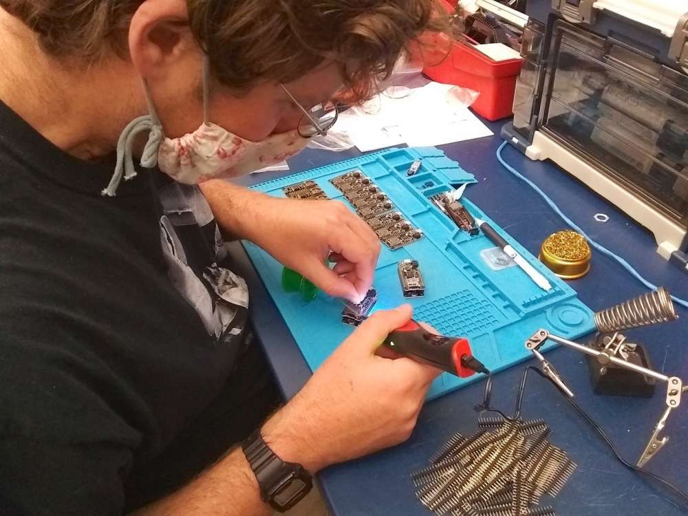 Co-investigator Dr. Ben Gutzler constructs one of the devices used to track lobsters on their journey "from catch to kitchen."