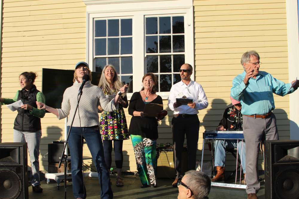 Singers at the front of the Laudholm barn