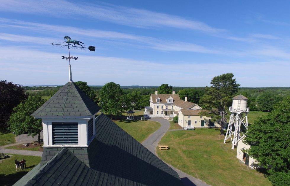 Weathervane and farmhouse, drone image