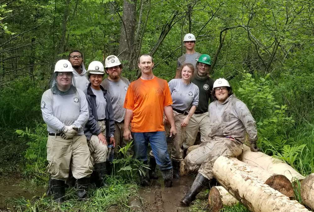 AmeriCorps Cedar 1 poses with project leader at Ghost Meadow.