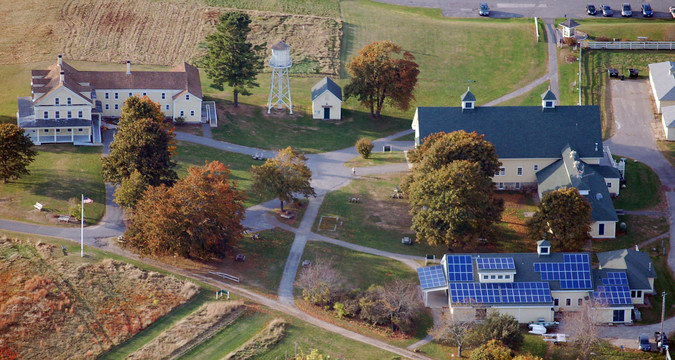 Aerial view of Wells Reserve Laudholm campus with Maine Coastal Ecology Center photovoltaic installation visible in lower right