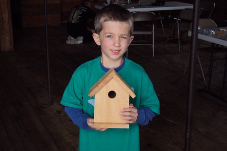 A proud owner of a new birdhouse!