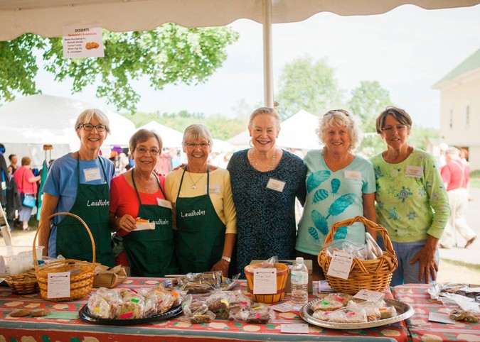 Dessert table volunteers. Photo by Heidi Kim.